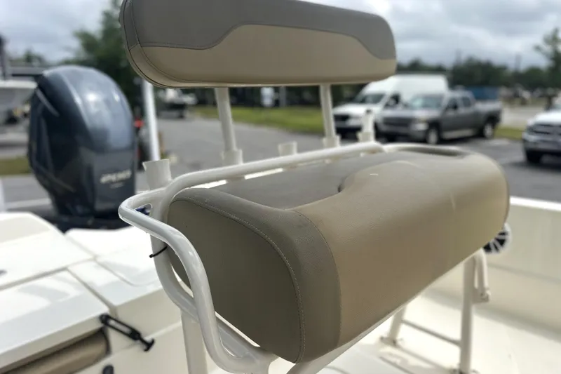 Slide: The Image of 2014 Skeeter SX2250 boat seat with beige upholstery and white frame. - 11