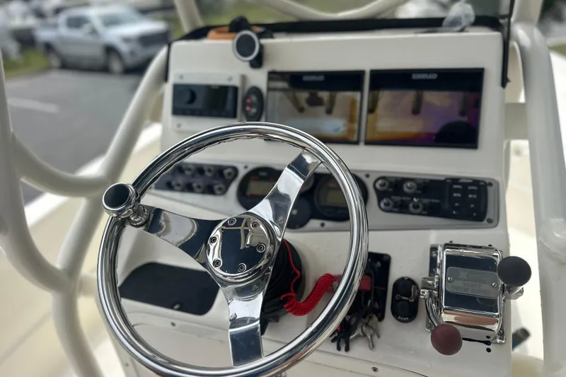 Slide: The Image of Steering console of a 2014 Skeeter SX2250 boat with navigation equipment. - 13