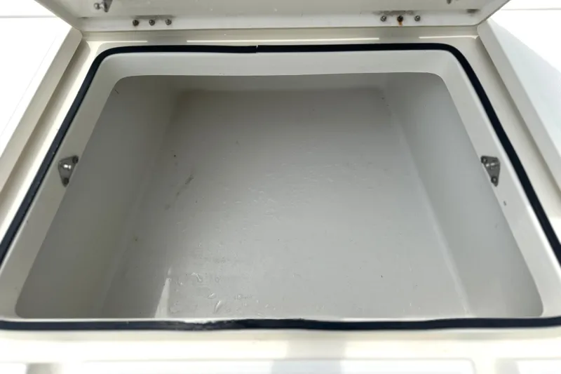 Slide: The Image of Open storage compartment on a 2014 Skeeter SX2250 boat, showcasing interior space. - 19