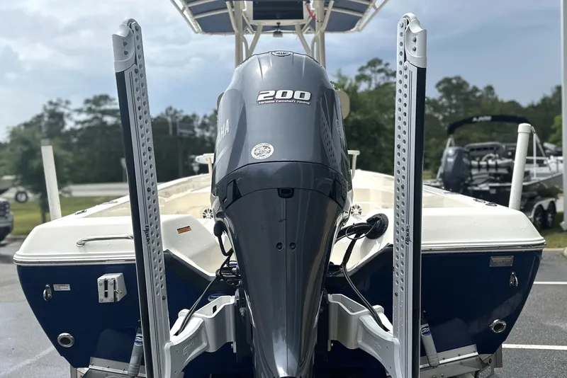 Slide: The Image of 2014 Skeeter SX2250 boat with Yamaha 200 engine, parked outdoors. - 5