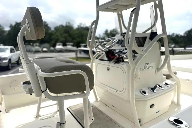 Slide: The Image of 2014 Skeeter SX2250 boat interior with steering console and seating. - 8
