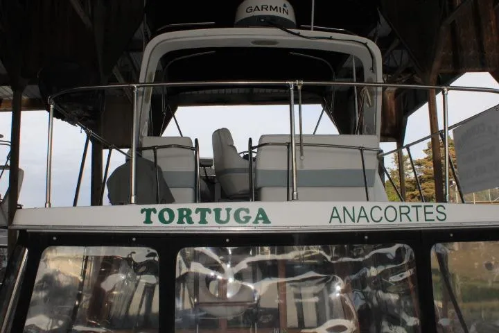 Slide: The Image of 1992 Bayliner 3288 Motoryacht "Tortuga" docked in Anacortes, featuring Garmin equipment. - 11