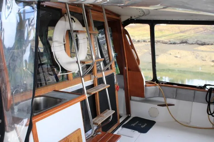 Slide: The Image of Interior view of 1992 Bayliner 3288 Motoryacht with ladder and life preserver. - 13