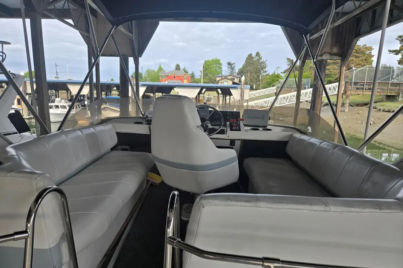 Slide: The Image of Interior view of a 1992 Bayliner 3288 Motoryacht with seating and steering area. - 14