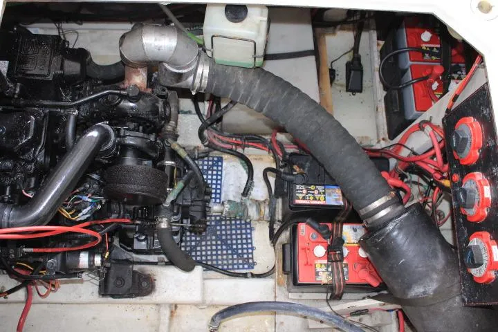 Slide: The Image of Engine compartment of a 1992 Bayliner 3288 Motoryacht with visible wiring and components. - 25