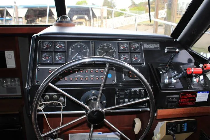 Slide: The Image of 1992 Bayliner 3288 Motoryacht dashboard with steering wheel and control panel. - 32