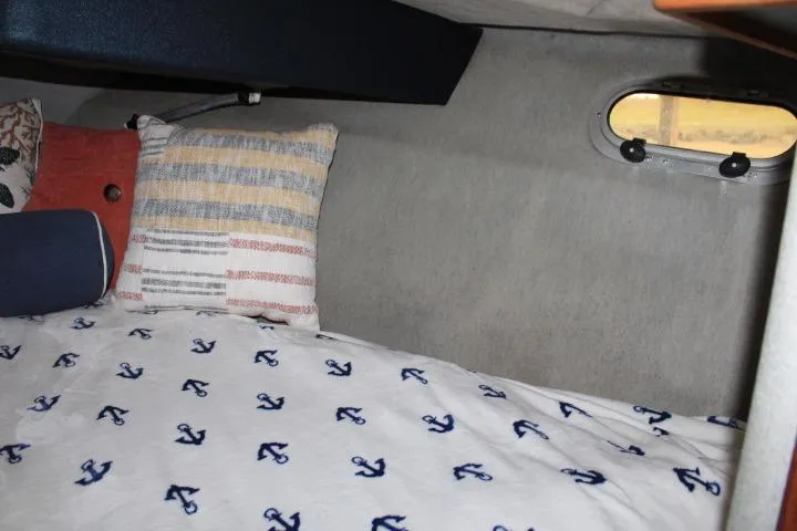 Slide: The Image of Cozy cabin interior of 1992 Bayliner 3288 Motoryacht with anchor-patterned bedding. - 43