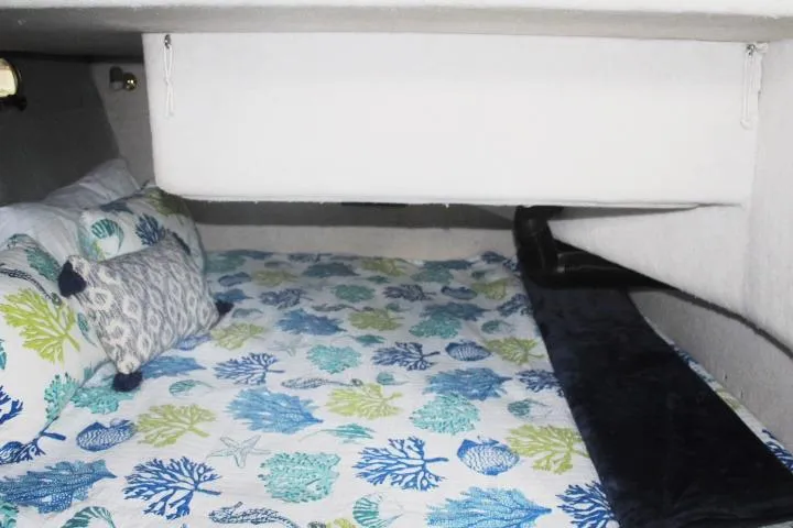 Slide: The Image of Cozy cabin interior of 1992 Bayliner 3288 Motoryacht with colorful bedding. - 51