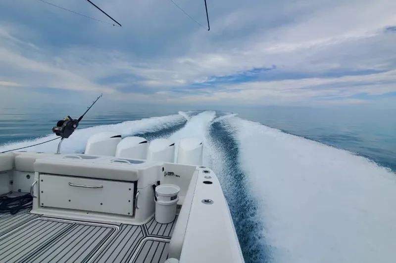 Slide: The Image of 2019 HCB 42 Siesta boat cruising on calm ocean waters under a cloudy sky. - 11