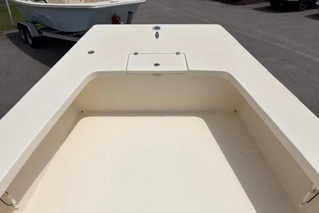 Slide: The Image of 2026 Jones Brothers Bateau 23 boat deck, featuring spacious storage compartment. - 5