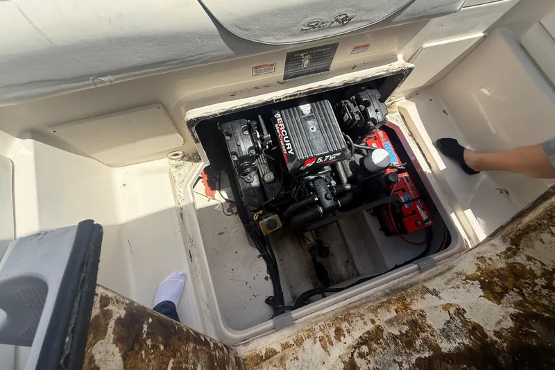 Slide: The Image of Open engine compartment of a 2004 Sea Ray 215 Weekender boat. - 18