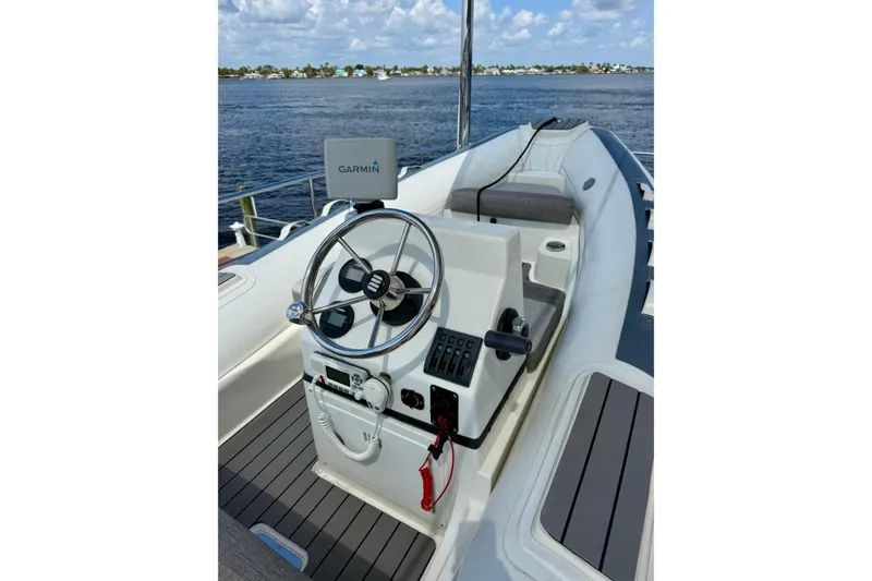 Slide: The Image of Steering console of a 2016 Caribe 16 boat with Garmin navigation system. - 3