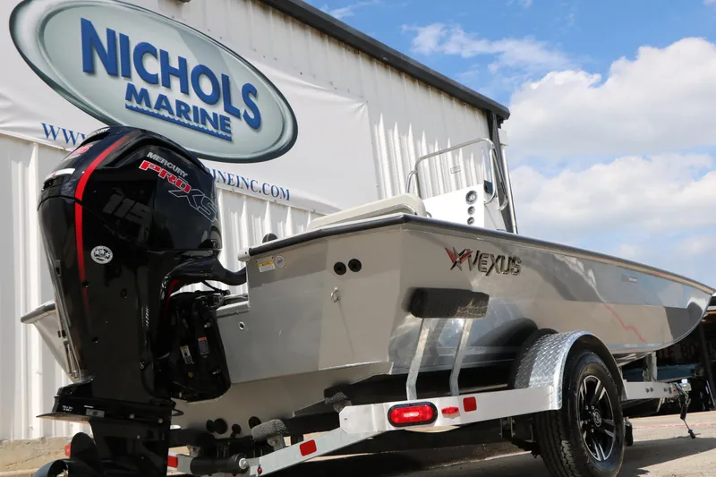 Slide: The Image of 2026 Vexus Defender 201 boat at Nichols Marine dealership with Mercury Pro XS engine. - 16