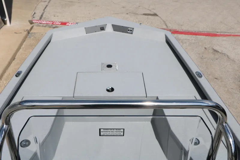 Slide: The Image of 2026 Vexus Defender 201 boat deck with stainless steel railing and storage compartment. - 20