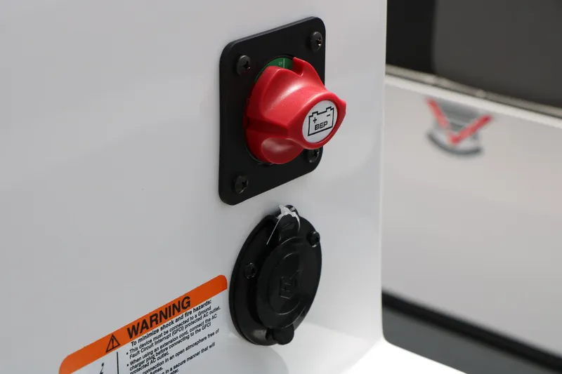 Slide: The Image of Close-up of a 2026 Vexus Defender 201 battery switch and warning label. - 27