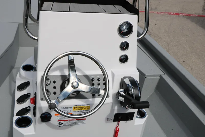 Slide: The Image of Steering console of 2026 Vexus Defender 201 boat with gauges and controls. - 28