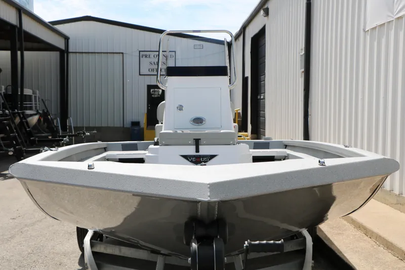 Slide: The Image of 2026 Vexus Defender 201 boat displayed outside a sales office. - 4
