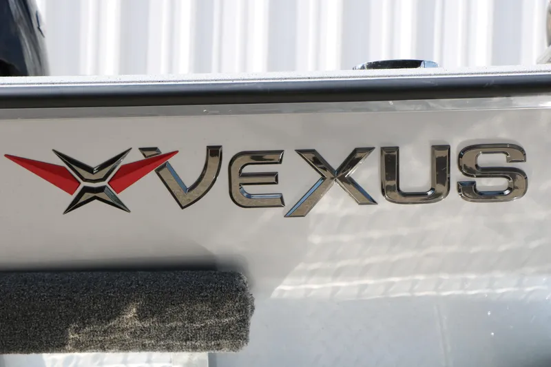 Slide: The Image of 2026 Vexus Defender 201 logo on a sleek metallic surface. - 6