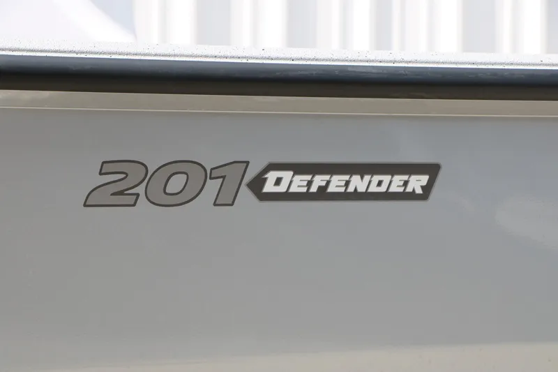 Slide: The Image of 2026 Vexus Defender 201 logo on vehicle exterior. - 7