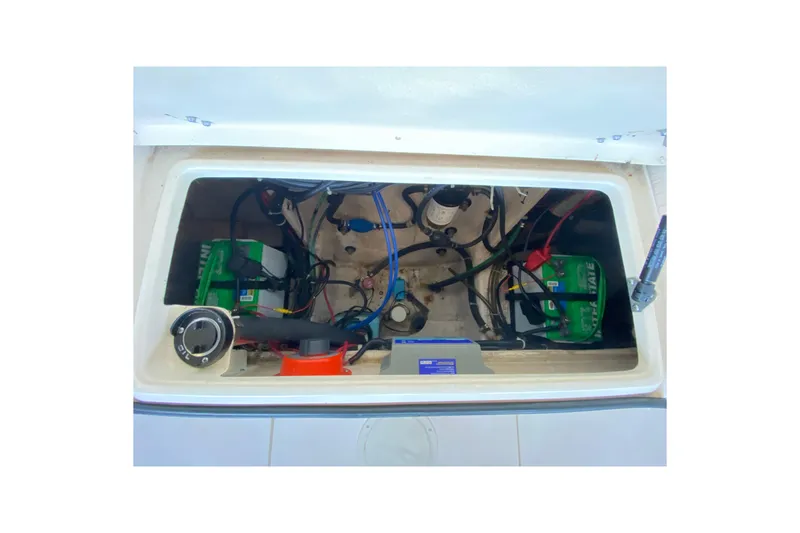 Slide: The Image of 1997 Grady-White Gulfstream 232 boat battery compartment with wiring and components. - 12