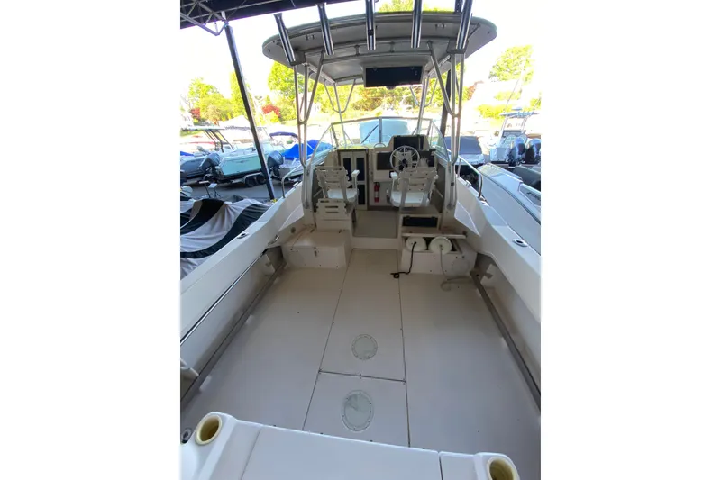 Slide: The Image of 1997 Grady-White Gulfstream 232 boat interior with steering wheel and seating area. - 3
