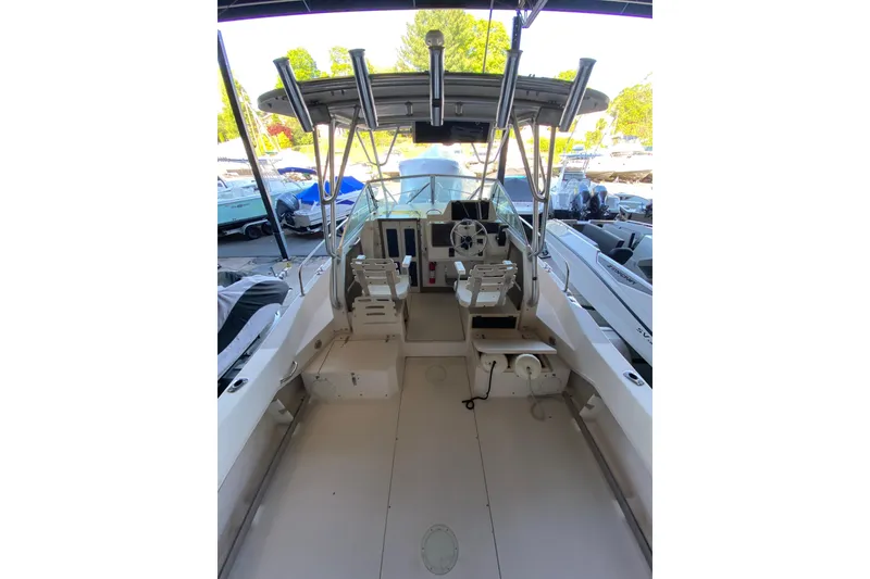 Slide: The Image of 1997 Grady-White Gulfstream 232 boat interior with helm and seating area. - 4