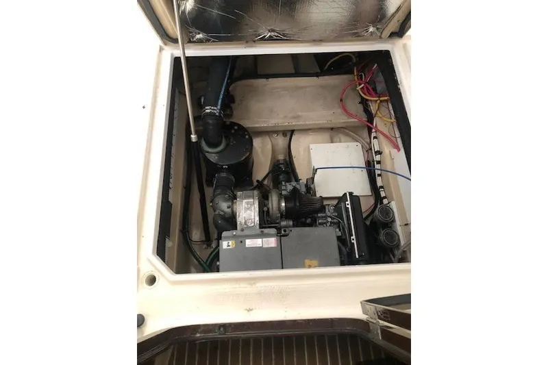 Slide: The Image of Engine compartment of a 2013 Ranger Tugs R-29 S boat, showing mechanical components. - 13
