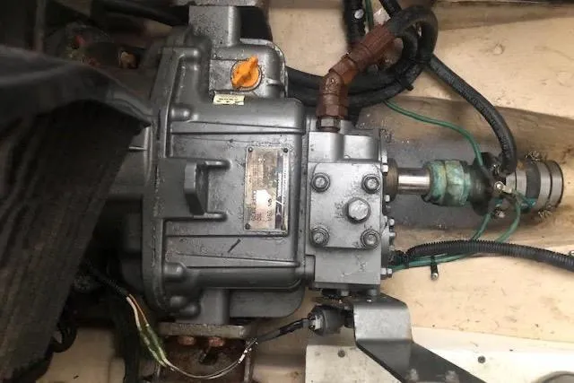 Slide: The Image of Engine compartment of a 2013 Ranger Tugs R-29 S, showcasing mechanical components and wiring. - 15