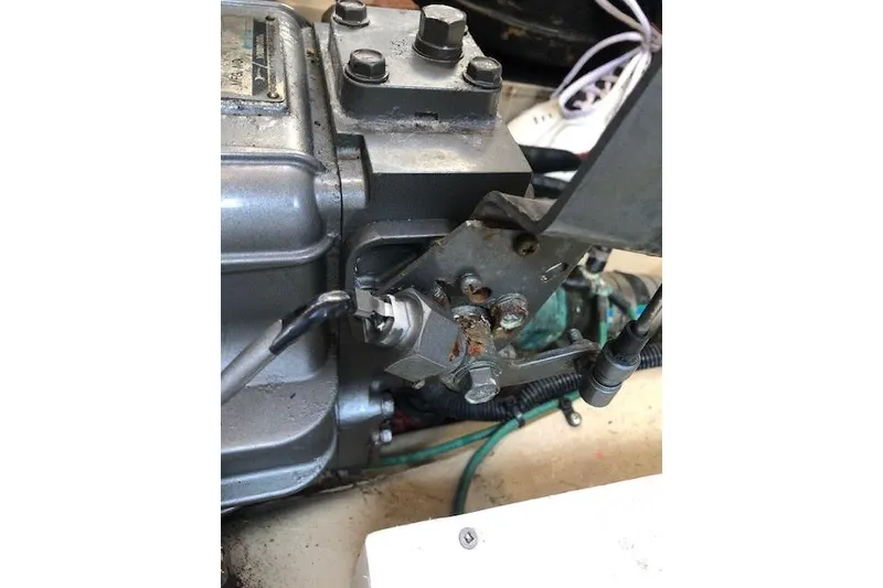 Slide: The Image of Engine component of a 2013 Ranger Tugs R-29 S boat, showing mechanical details and wiring. - 16