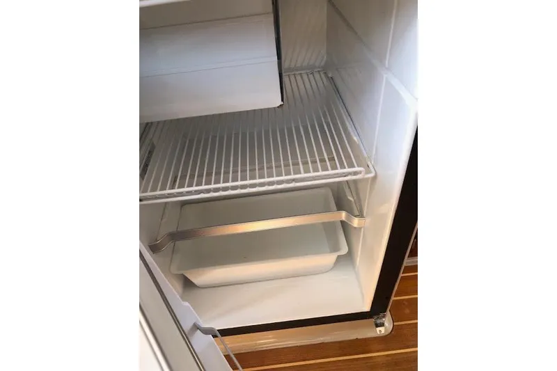 Slide: The Image of Empty refrigerator inside a 2013 Ranger Tugs R-29 S boat. - 20