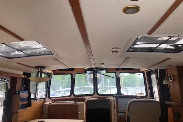 Slide: The Image of Interior view of 2013 Ranger Tugs R-29 S boat, featuring spacious cabin and large windows. - 21