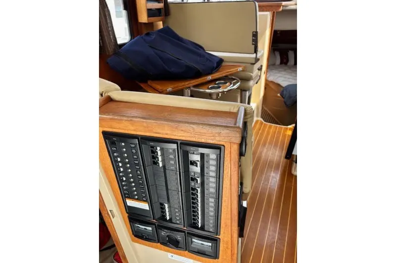 Slide: The Image of 2013 Ranger Tugs R-29 S interior with control panel and wooden flooring. - 23