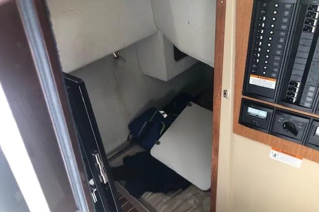 Slide: The Image of Interior cabin of 2013 Ranger Tugs R-29 S with control panel and storage area. - 26