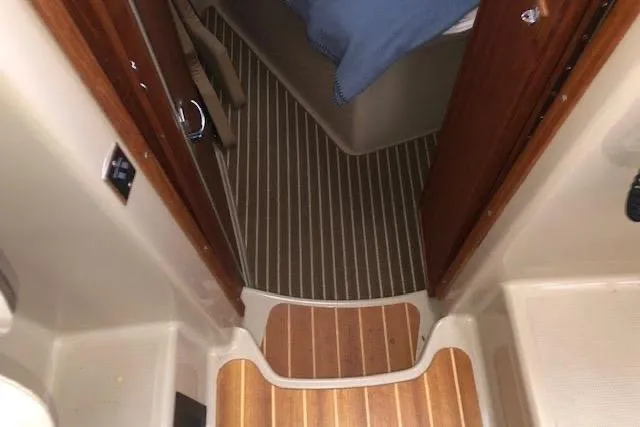Slide: The Image of Interior view of 2013 Ranger Tugs R-29 S boat with wooden flooring. - 27