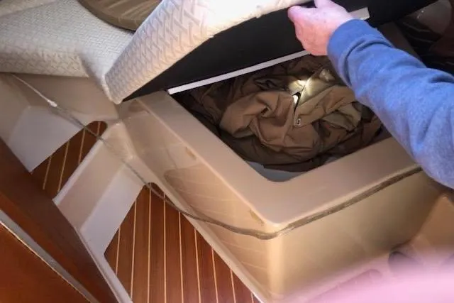 Slide: The Image of Interior storage compartment of 2013 Ranger Tugs R-29 S boat with wooden flooring. - 35