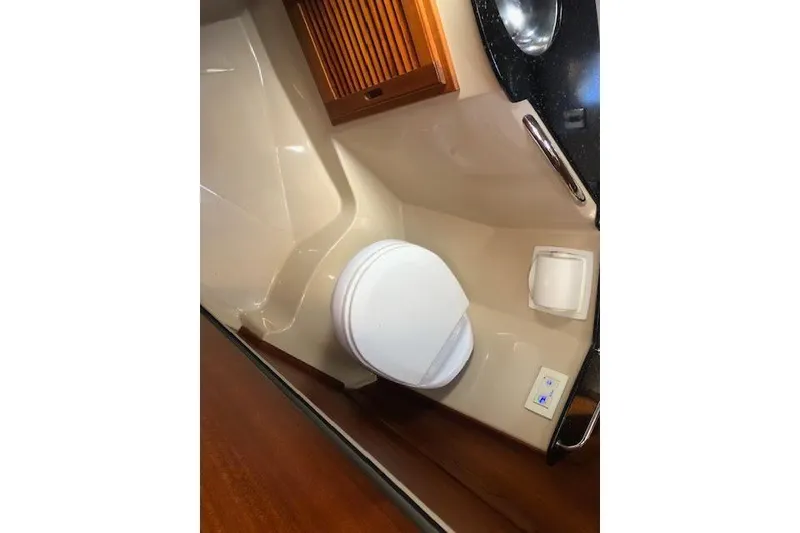 Slide: The Image of 2013 Ranger Tugs R-29 S boat bathroom with toilet and sink. - 38