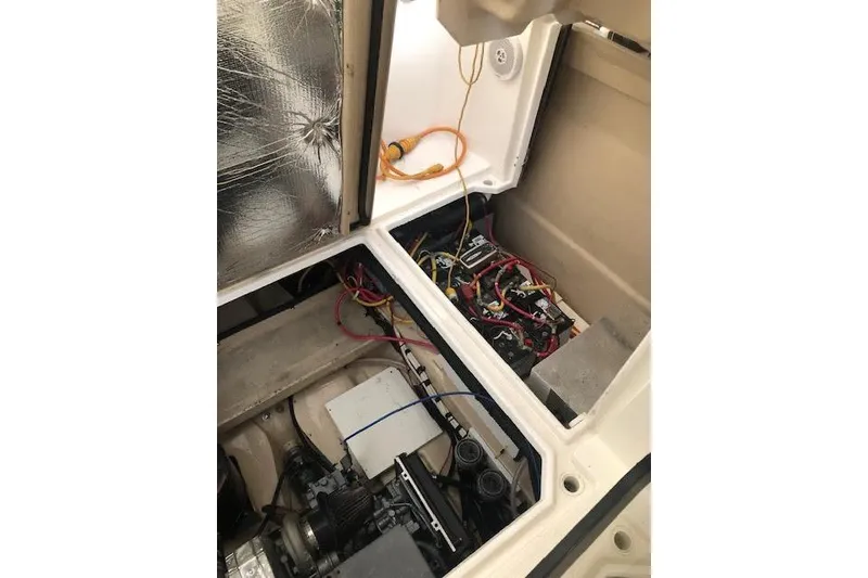 Slide: The Image of Engine compartment of a 2013 Ranger Tugs R-29 S, showing wiring and components. - 39