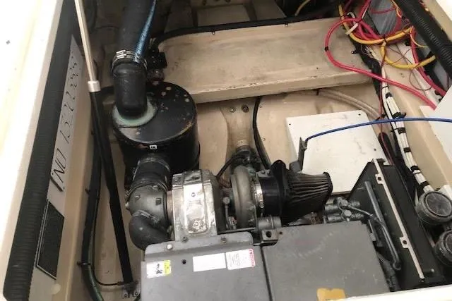 Slide: The Image of Engine compartment of a 2013 Ranger Tugs R-29 S with visible wiring and components. - 41
