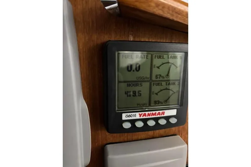 Slide: The Image of Yanmar fuel gauge display on 2013 Ranger Tugs R-29 S, showing fuel levels and engine hours. - 49