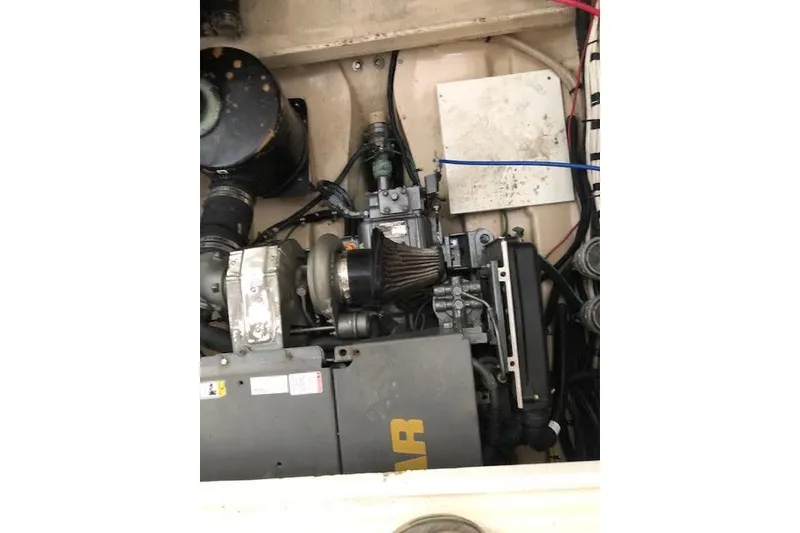 Slide: The Image of Engine compartment of a 2013 Ranger Tugs R-29 S boat, showcasing mechanical components. - 51