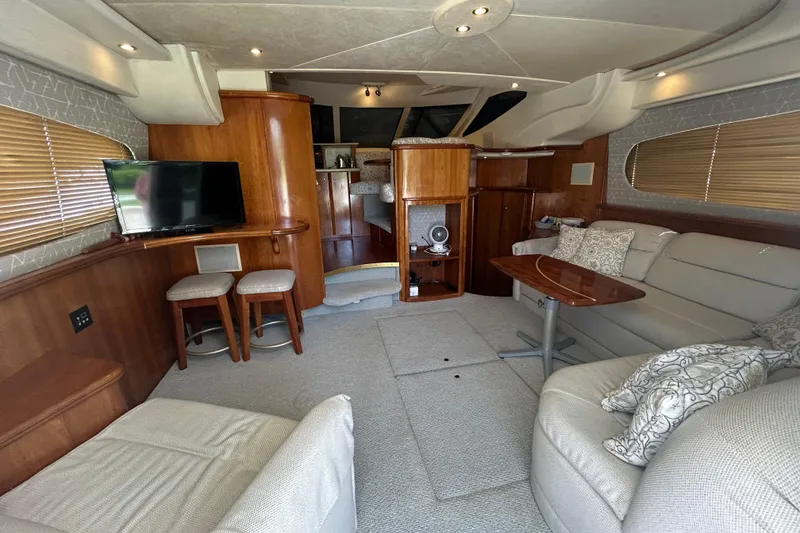 Slide: The Image of Luxurious interior of 2001 Silverton 410 Sport Bridge yacht with cozy seating and modern amenities. - 18