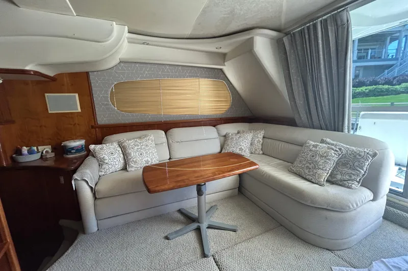 Slide: The Image of Interior of 2001 Silverton 410 Sport Bridge with cozy seating and elegant decor. - 27