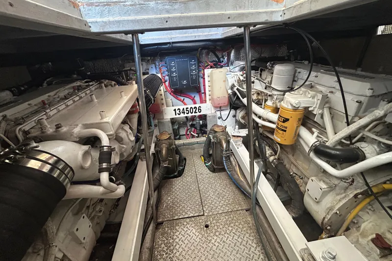 Slide: The Image of Engine room of a 2001 Silverton 410 Sport Bridge with visible machinery and components. - 5