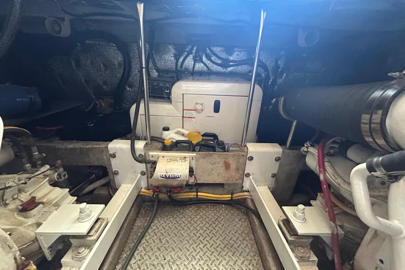 Slide: The Image of Engine room of a 2001 Silverton 410 Sport Bridge with visible machinery and components. - 6