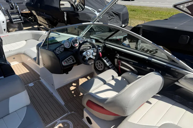 Slide: The Image of 2008 MasterCraft X-45 boat interior with steering wheel and seating. - 12