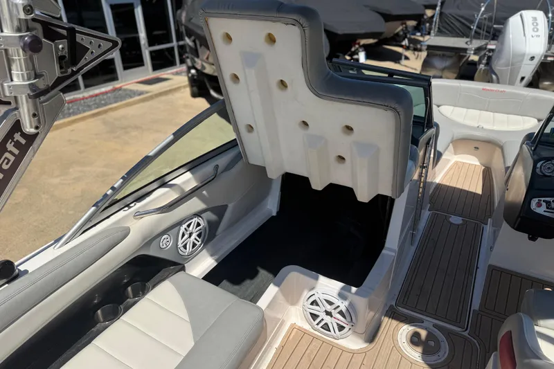Slide: The Image of 2008 MasterCraft X-45 boat interior with seating, speakers, and storage compartments. - 13