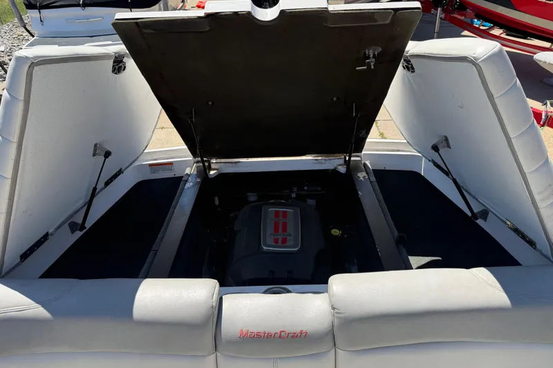 Slide: The Image of 2008 MasterCraft X-45 boat engine compartment with open hatch, showcasing interior details. - 15