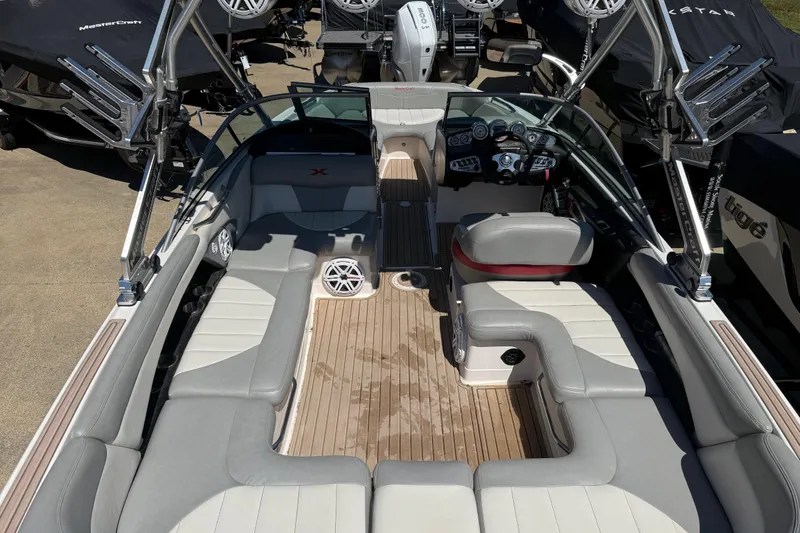 Slide: The Image of 2008 MasterCraft X-45 boat interior with spacious seating and modern dashboard. - 18