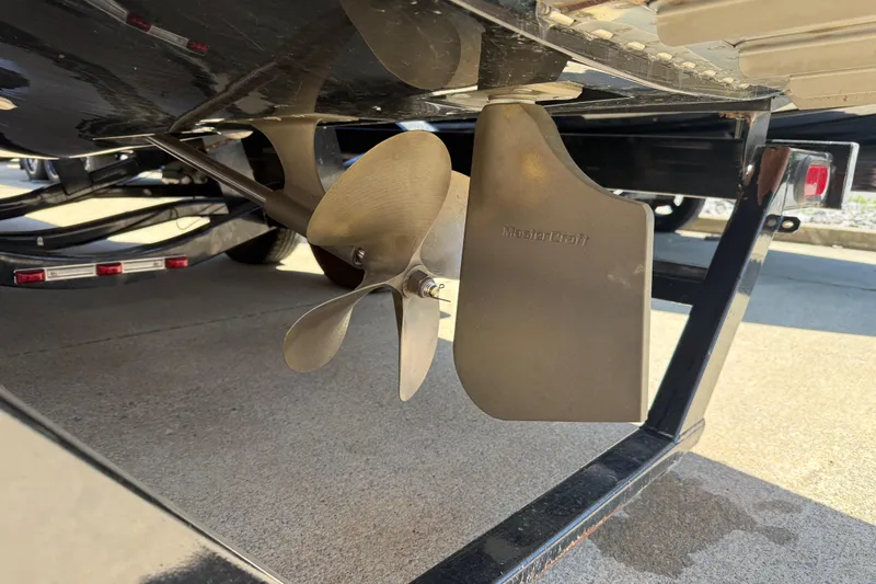 Slide: The Image of Propeller and rudder of a 2008 MasterCraft X-45 boat on a trailer. - 20
