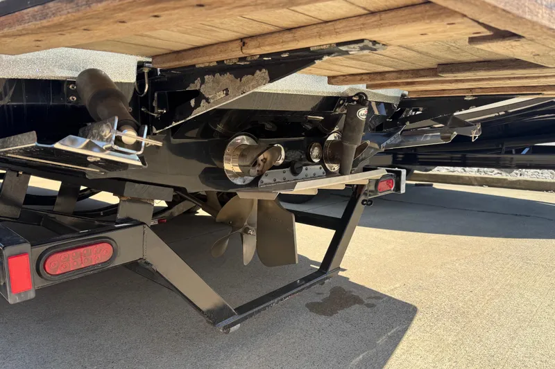 Slide: The Image of 2008 MasterCraft X-45 boat propeller and trailer detail on concrete surface. - 21